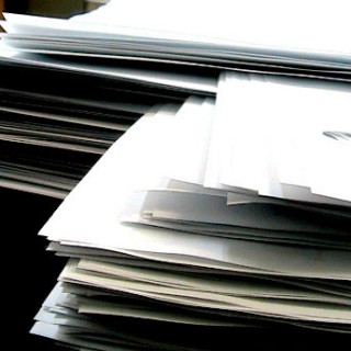 Stacks of White Paper by FeatherdTar